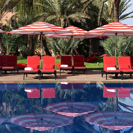 Moevenpick Hotel Mansour Eddahbi Marrakech Марракеш Экстерьер фото The pool at the hotel